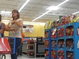 Candid milf fingers her tits.