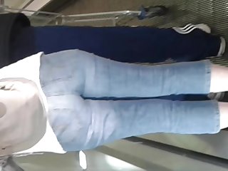 Escalator Milf in blue jeans short hair!