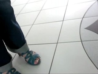Friend's feet in blue sandals